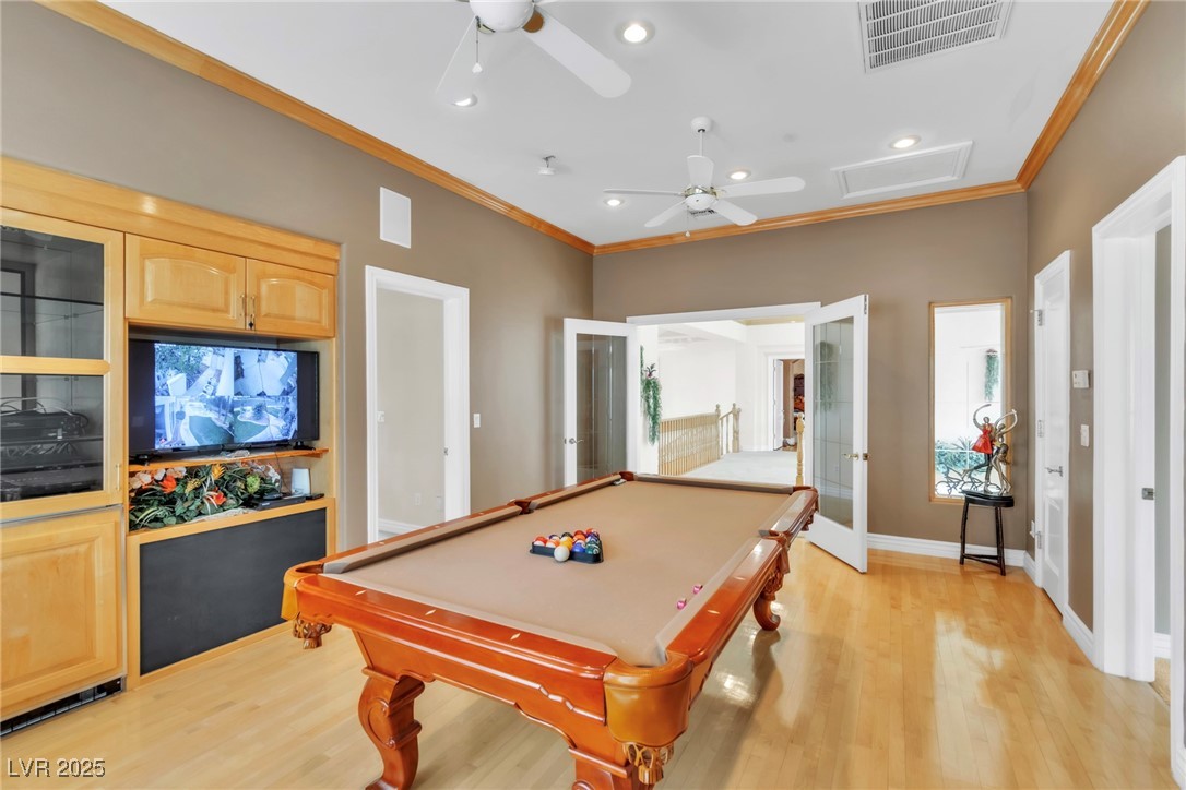 23 Cascade Creek Lane Las Vegas, NV 89113 - Photo 60 of 89 Rec room with crown molding, recessed lighting, light wood finished floors, ceiling fan, and billiards table