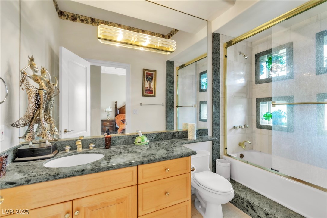 23 Cascade Creek Lane Las Vegas, NV 89113 - Photo 63 of 89 Ensuite bathroom with vanity and bath / shower combo with glass door