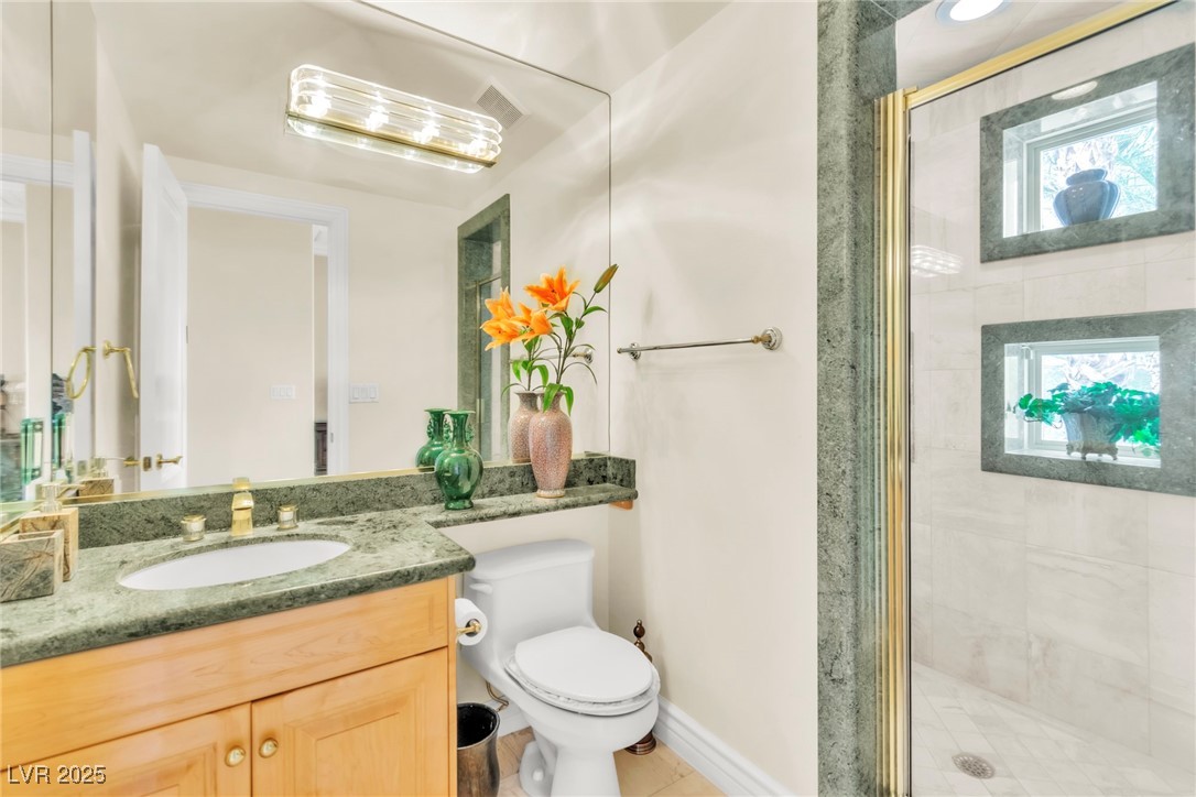 23 Cascade Creek Lane Las Vegas, NV 89113 - Photo 66 of 89 Bathroom featuring vanity and a shower stall