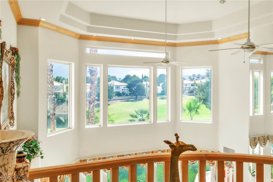 23 Cascade Creek Lane Las Vegas, NV 89113 - Photo 79 of 89 Detailed view of a raised ceiling, crown molding, and a ceiling fan