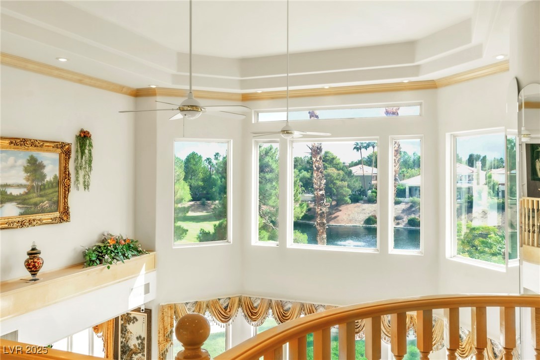 23 Cascade Creek Lane Las Vegas, NV 89113 - Photo 80 of 89 Detailed view of a ceiling fan, ornamental molding, a raised ceiling, and nearby water