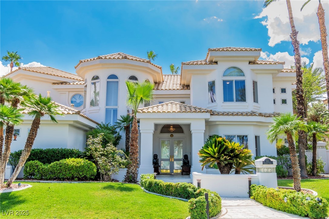 23 Cascade Creek Lane Las Vegas, NV 89113 - Photo 9 of 89 Mediterranean / spanish house with french doors, a tiled roof, and a front lawn