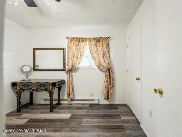 a view of entryway with wooden floor