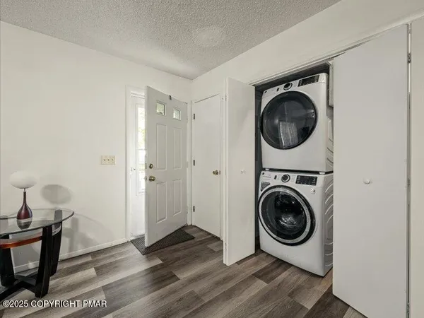 a view of a hallway with washer and dryer
