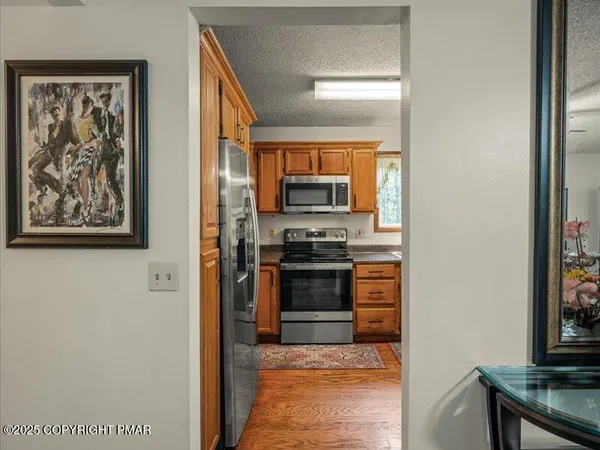 a kitchen with stainless steel appliances a stove and a refrigerator
