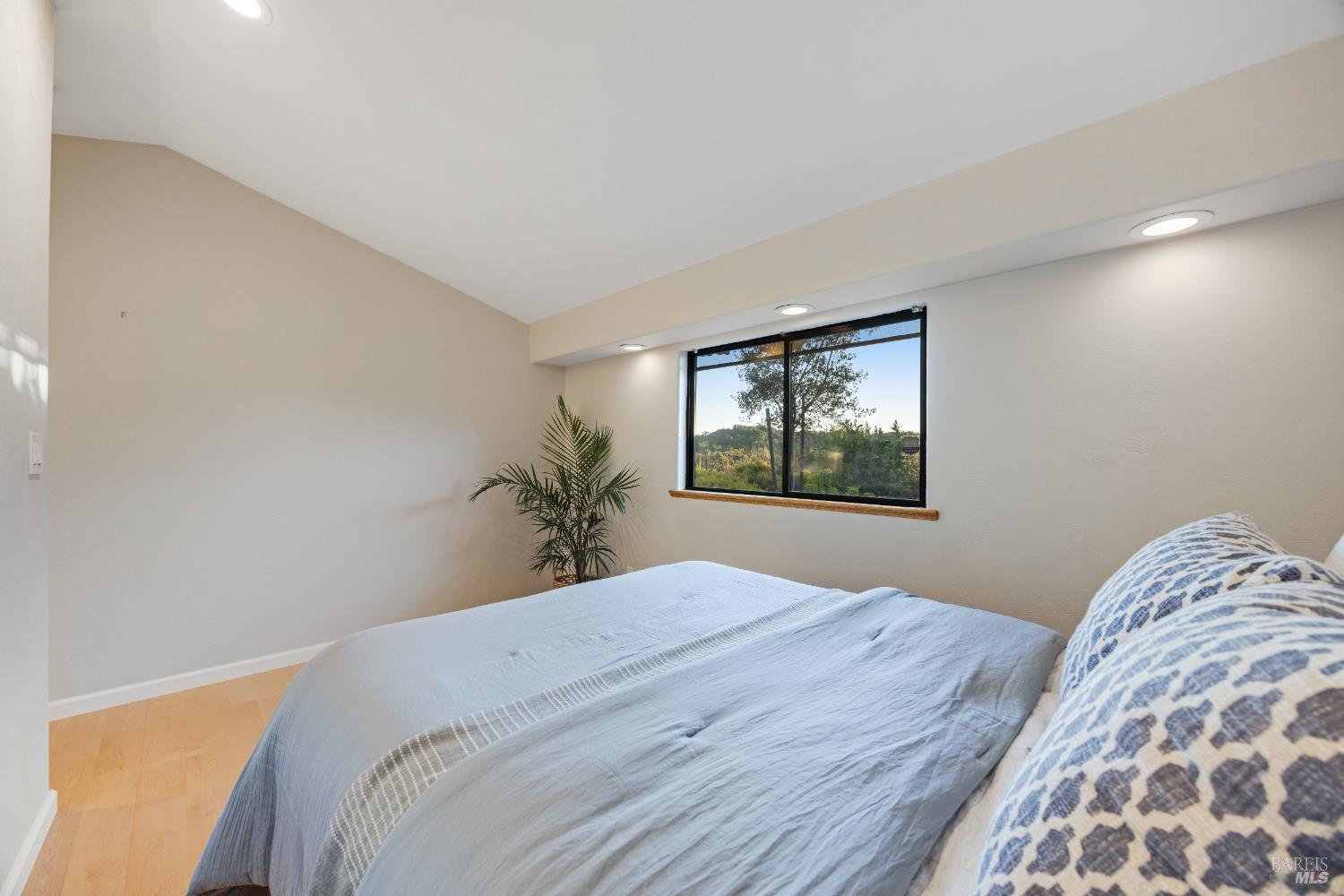 6960 Round Oak Road Penngrove, CA 94951 - Photo 32 of 58 a bedroom with a bed and a window