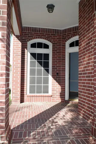 a front view of a house with a large window