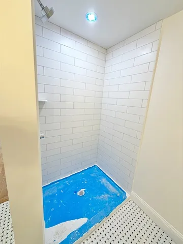 a bathroom with a sink and a shower