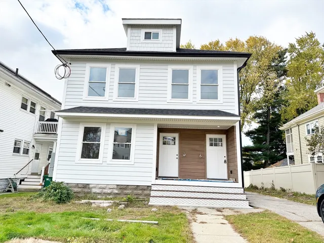 a view of a house with a yard
