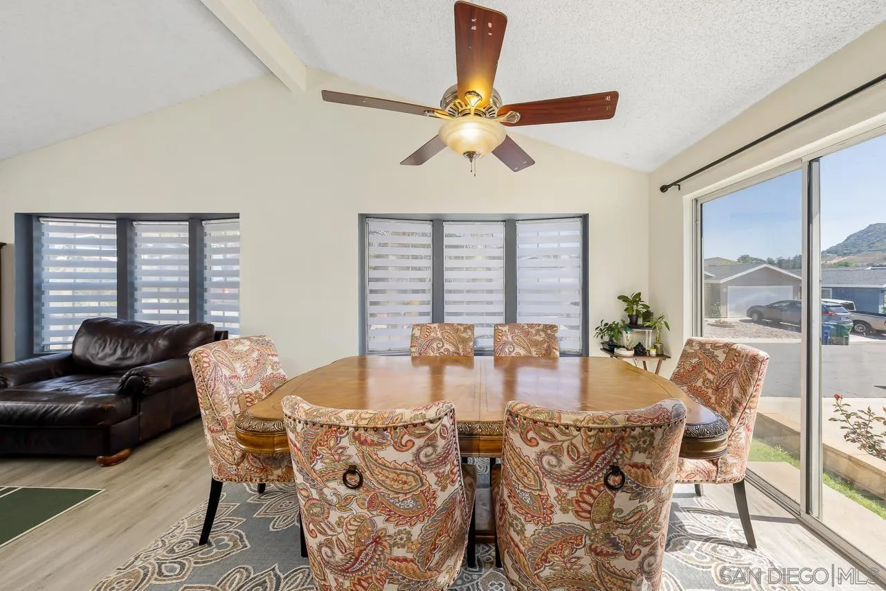 15935 Spring Oaks Road, Unit 201 El Cajon, CA 92021 - Photo 11 of 32 a view of a dining room with furniture window and outside view