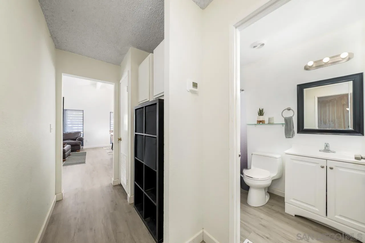15935 Spring Oaks Road, Unit 201 El Cajon, CA 92021 - Photo 19 of 32 a bathroom with a toilet sink and a mirror