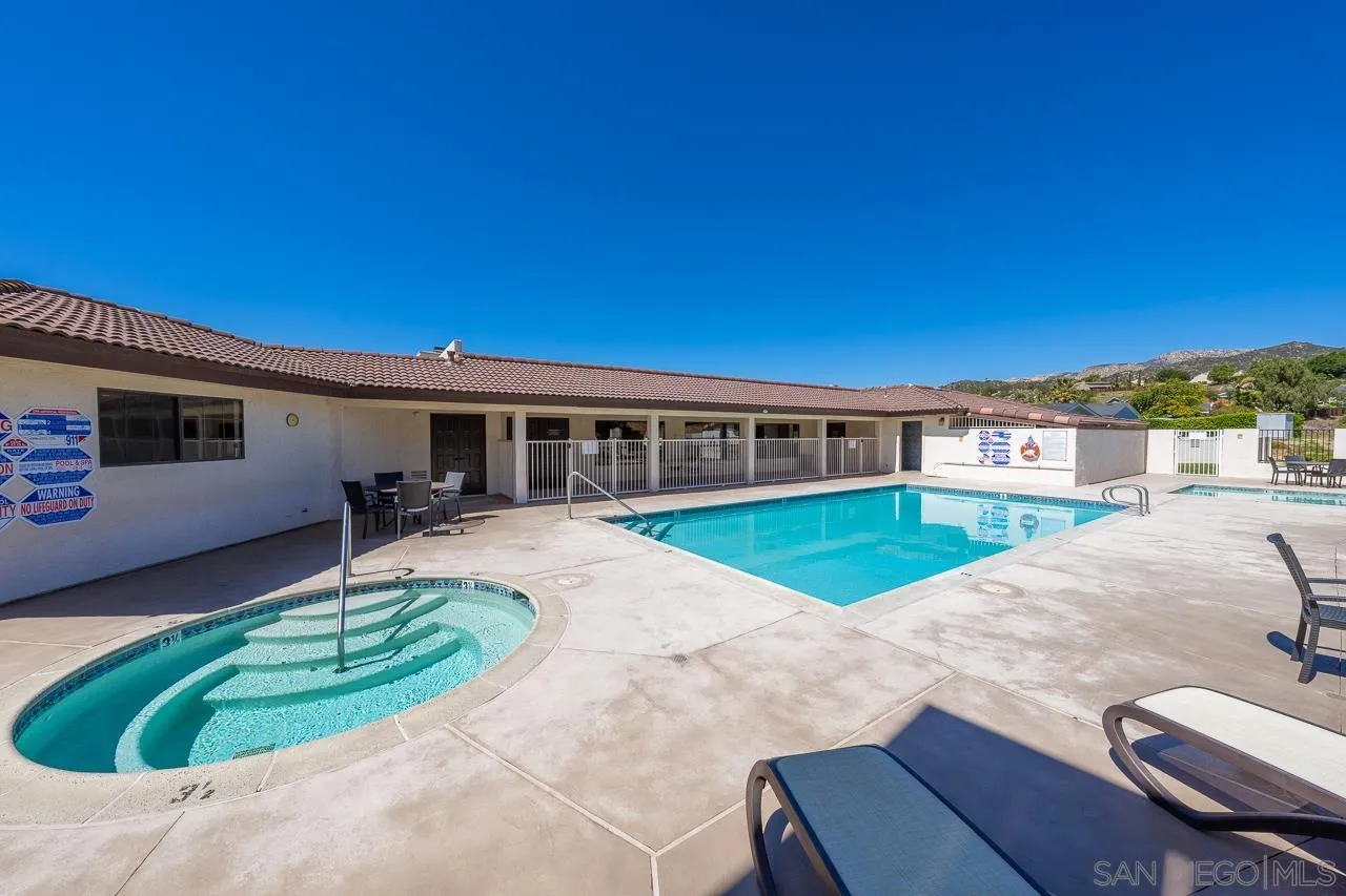 15935 Spring Oaks Road, Unit 201 El Cajon, CA 92021 - Photo 30 of 32 a front view of house with yard and green space