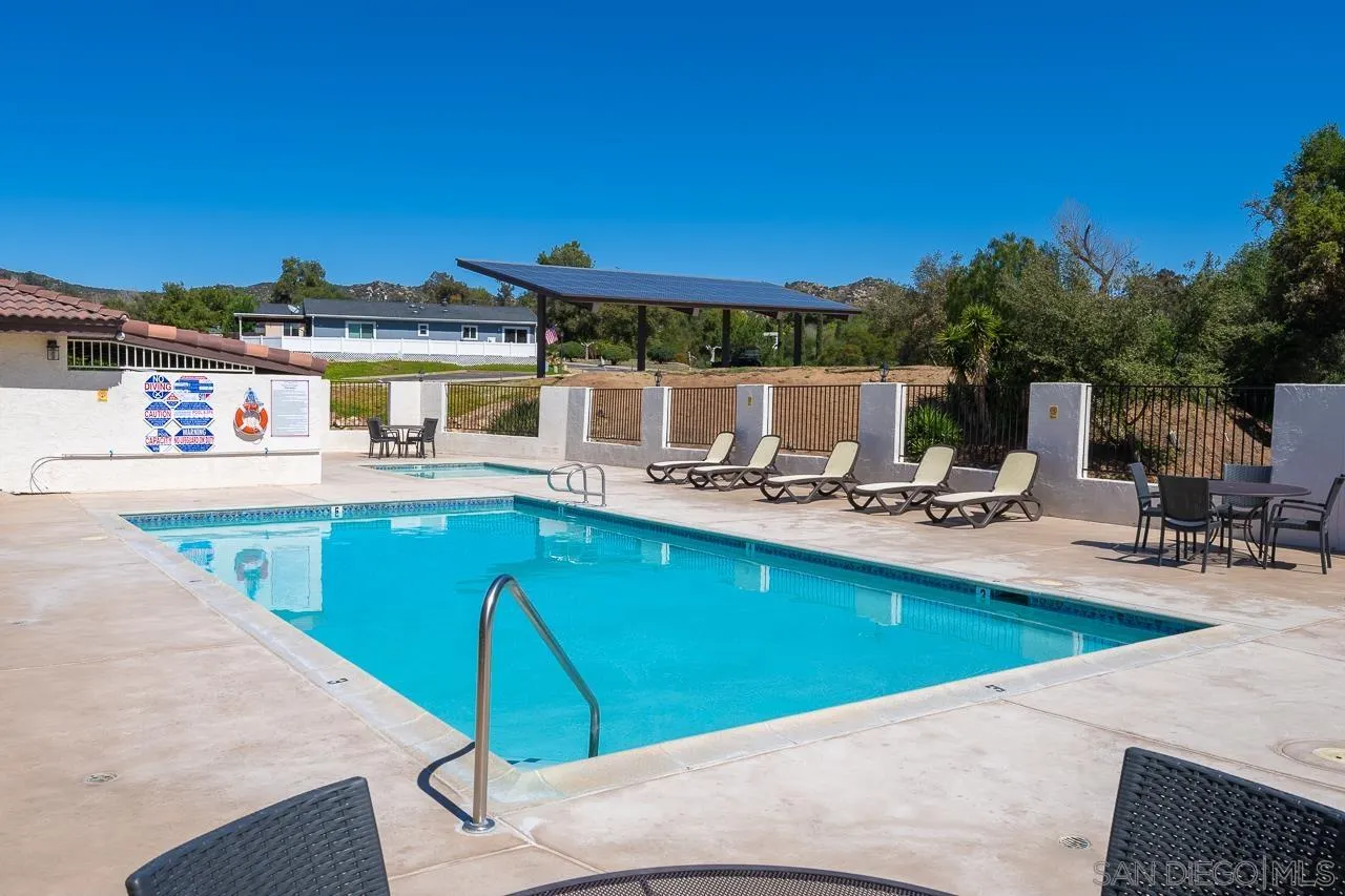 15935 Spring Oaks Road, Unit 201 El Cajon, CA 92021 - Photo 31 of 32 a view of a swimming pool with outdoor seating