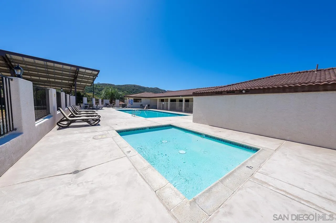 15935 Spring Oaks Road, Unit 201 El Cajon, CA 92021 - Photo 32 of 32 a view of a patio with chairs and plants