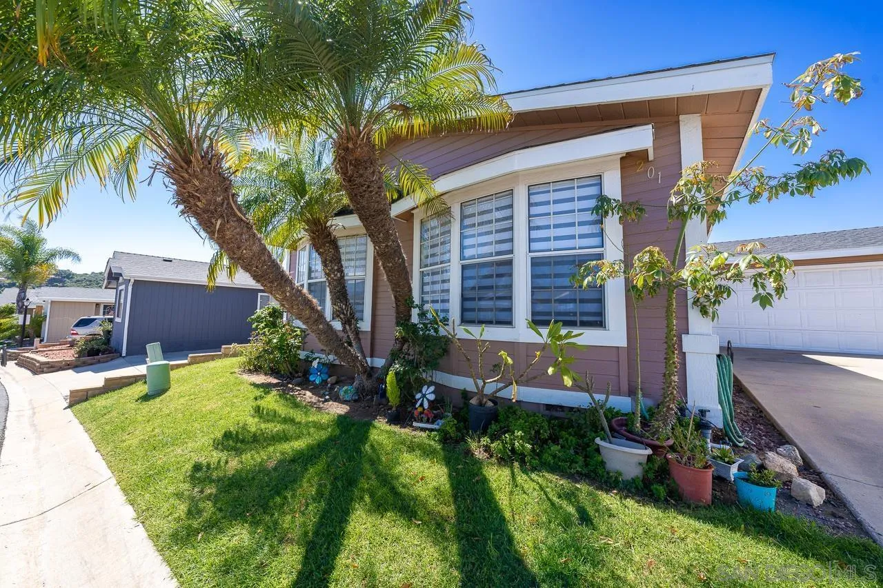 15935 Spring Oaks Road, Unit 201 El Cajon, CA 92021 - Photo 4 of 32 a front view of a house with a yard