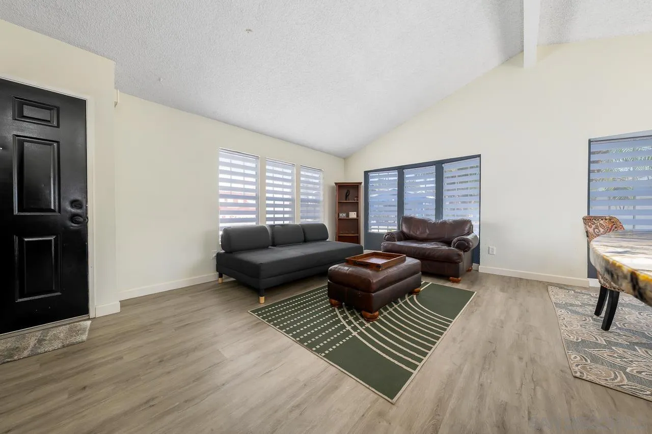 15935 Spring Oaks Road, Unit 201 El Cajon, CA 92021 - Photo 9 of 32 a living room with furniture and a rug