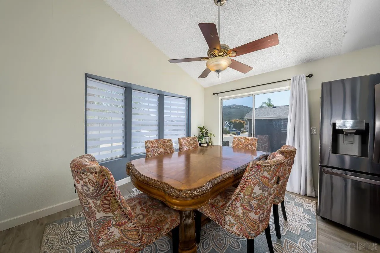 15935 Spring Oaks Road, Unit 201 El Cajon, CA 92021 - Photo 10 of 32 a view of a dining room with furniture window and outside view