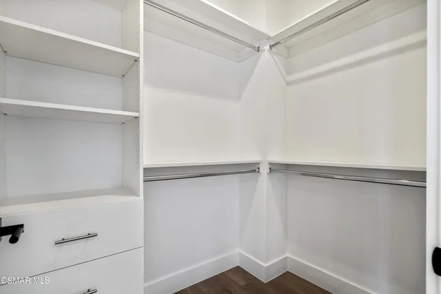 a view of an empty walk in closet