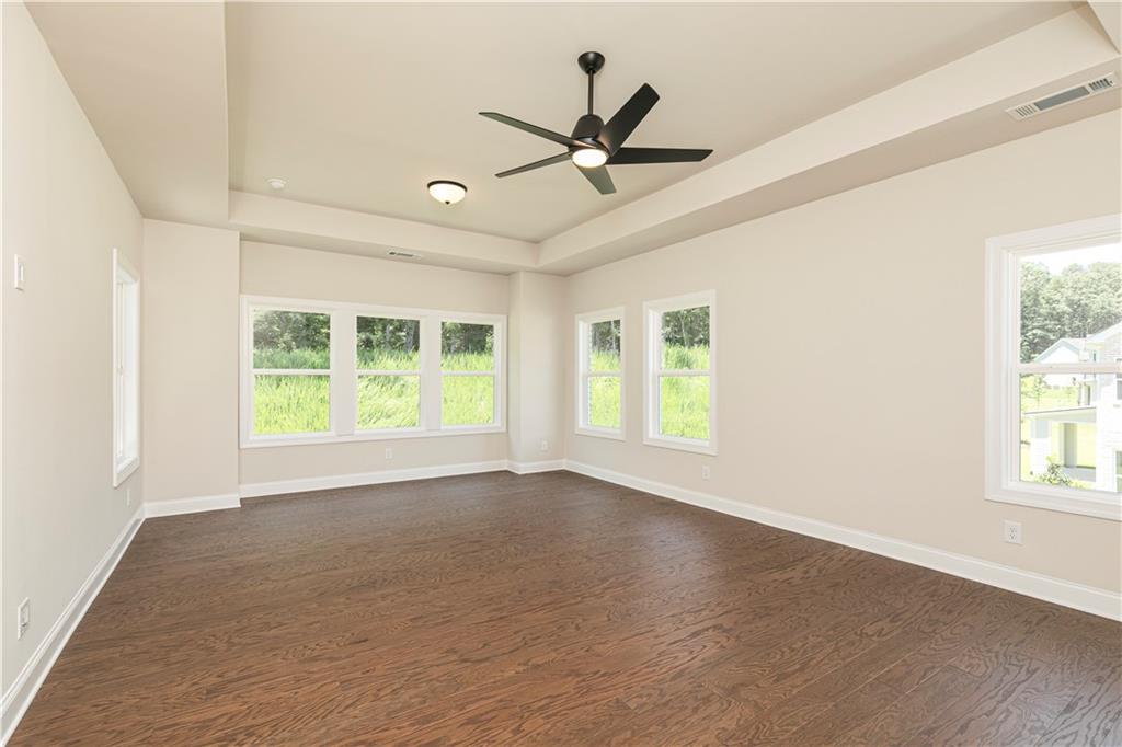 2475 Stewart Road Cumming, GA 30041 - Photo 18 of 30 a view of a livingroom with a ceiling fan and window