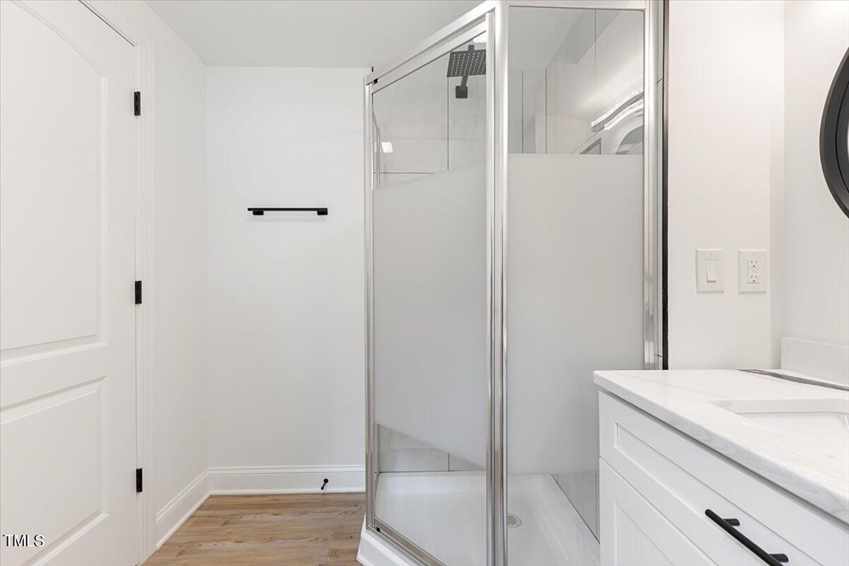 3420 Brentwood Road Raleigh, NC 27604 - Photo 24 of 53 a bathroom with a granite countertop sink and shower