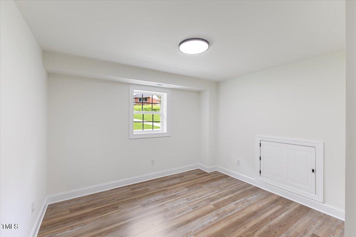 3420 Brentwood Road Raleigh, NC 27604 - Photo 30 of 53 an empty room with a window