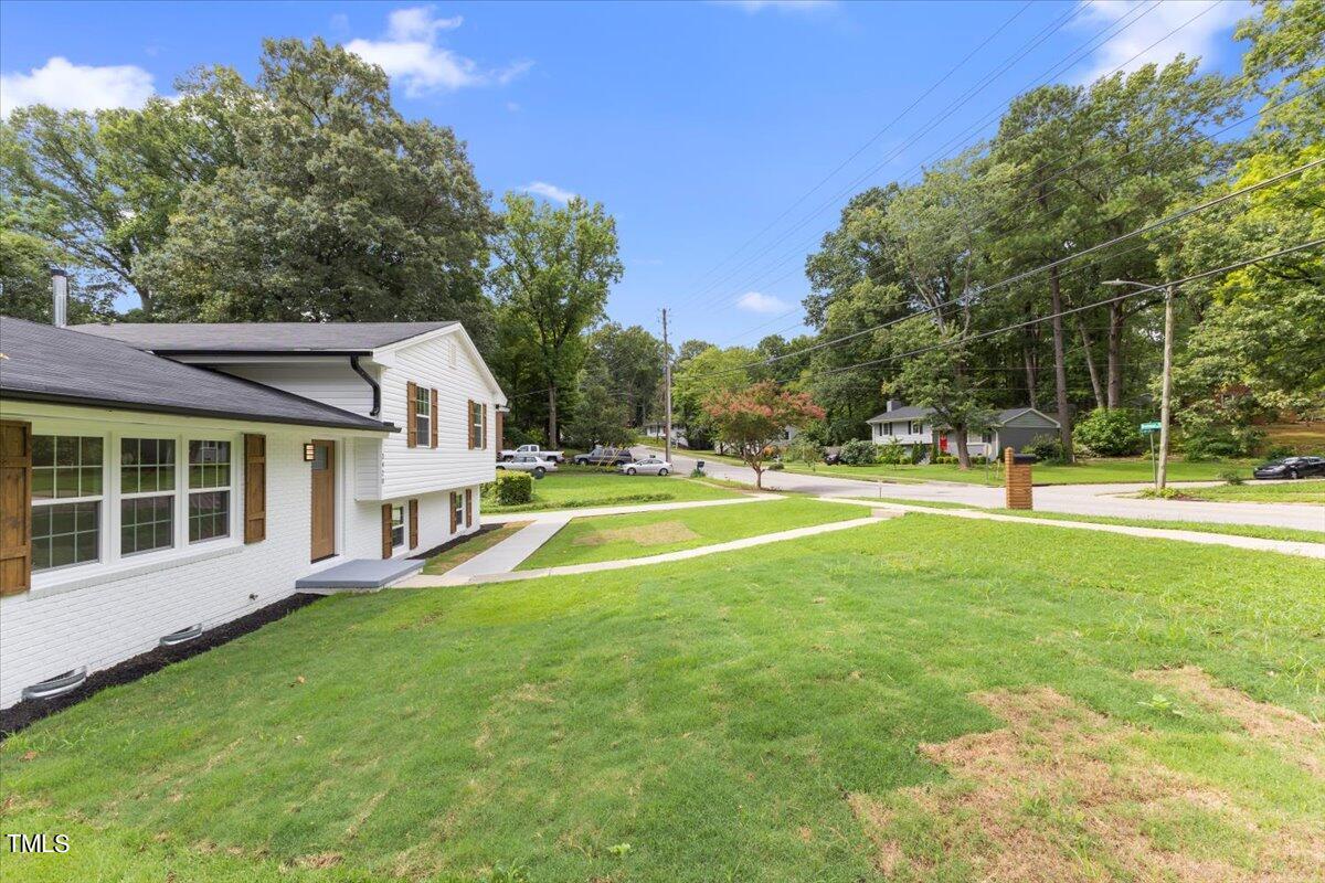 3420 Brentwood Road Raleigh, NC 27604 - Photo 3 of 53 a view of an house with swimming pool and yard