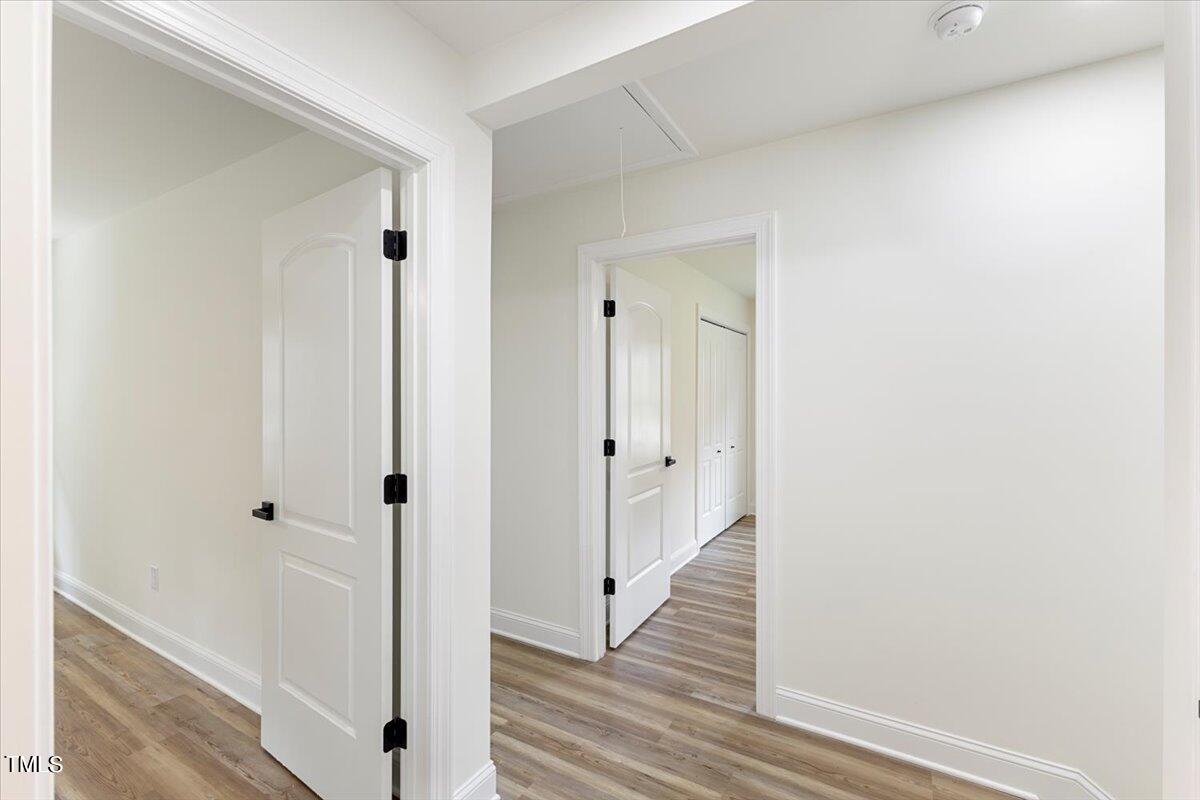 3420 Brentwood Road Raleigh, NC 27604 - Photo 35 of 53 a view of a hallway with wooden floor