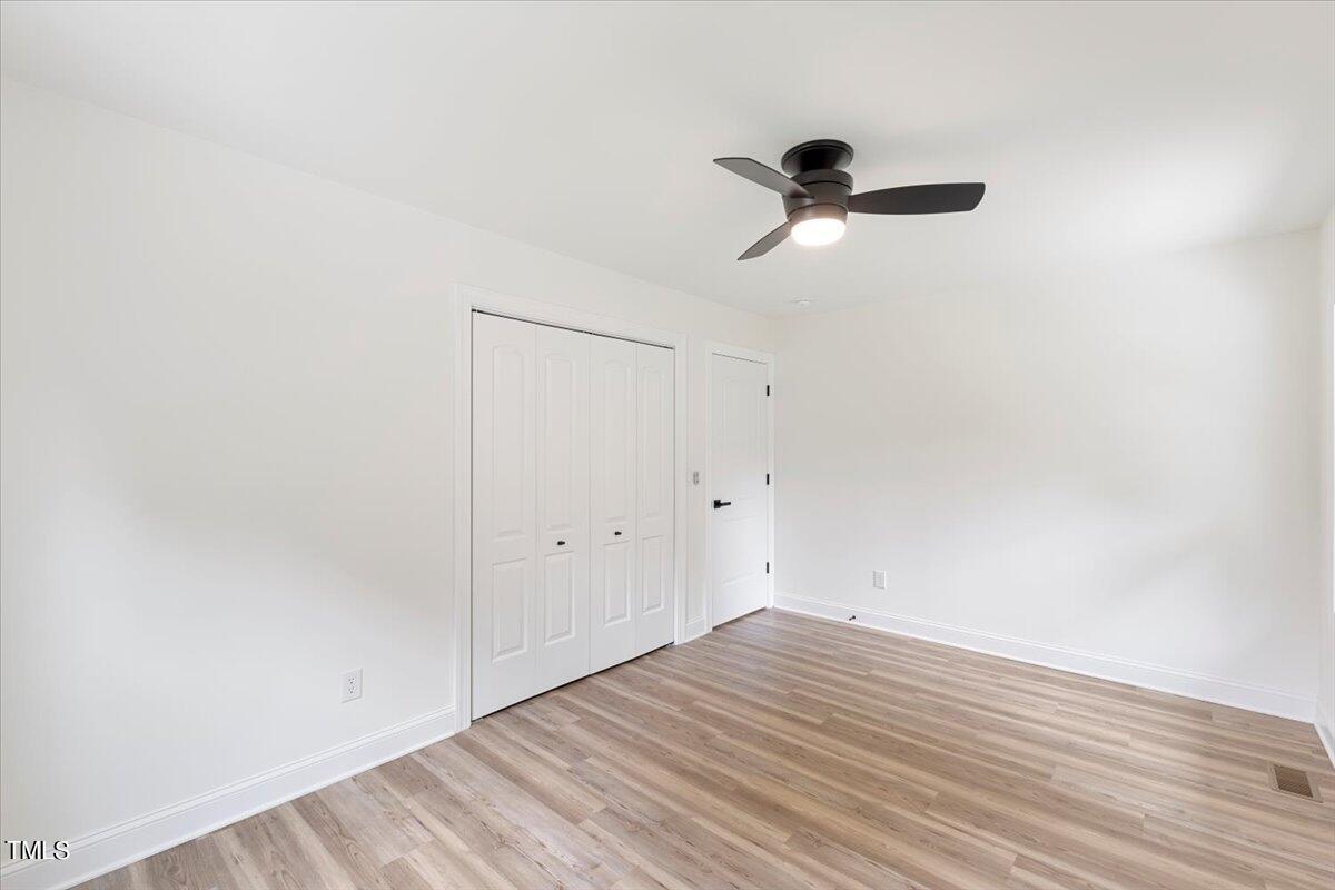 3420 Brentwood Road Raleigh, NC 27604 - Photo 39 of 53 a view of empty room with wooden floor
