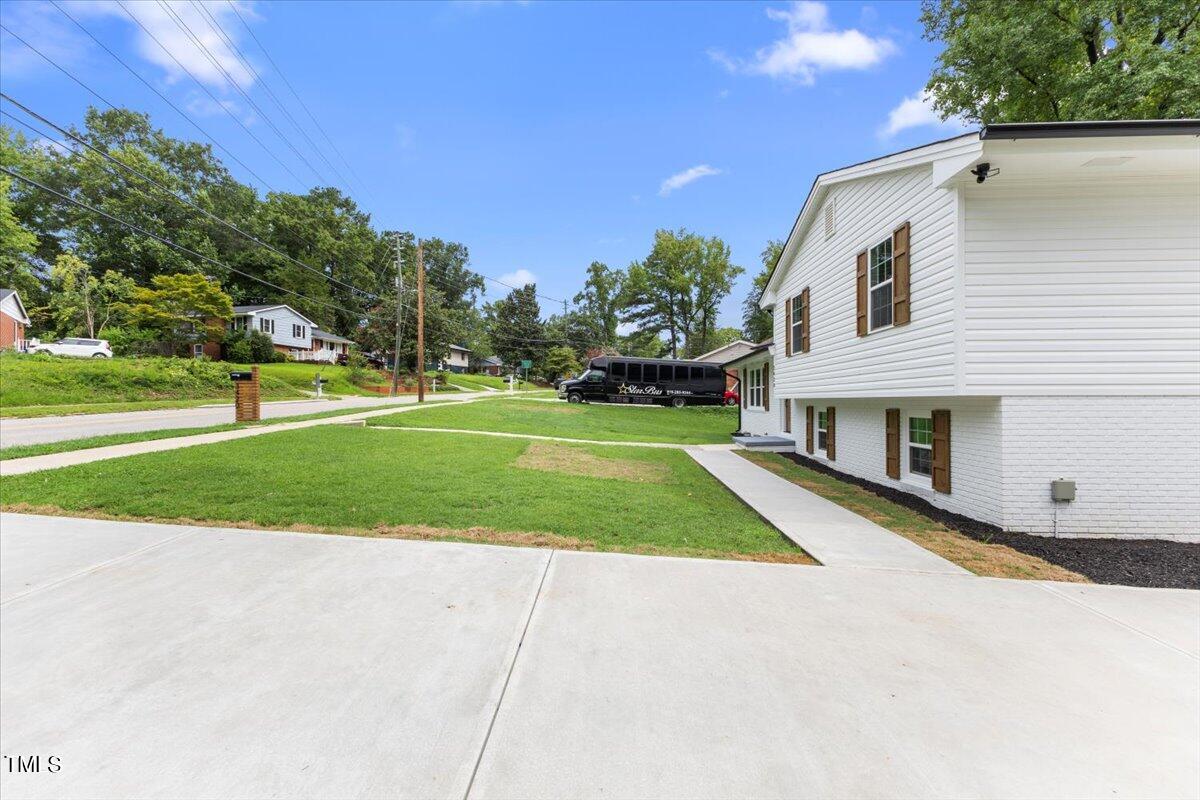 3420 Brentwood Road Raleigh, NC 27604 - Photo 4 of 53 a front view of a house with a yard and garage