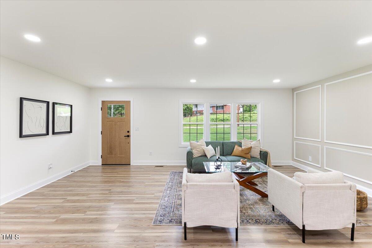 3420 Brentwood Road Raleigh, NC 27604 - Photo 6 of 53 a living room with furniture and a window