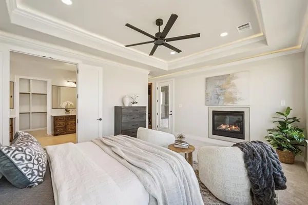 a bedroom with a bed and a fireplace