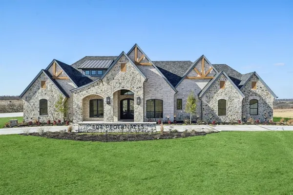 a front view of house with yard and green space