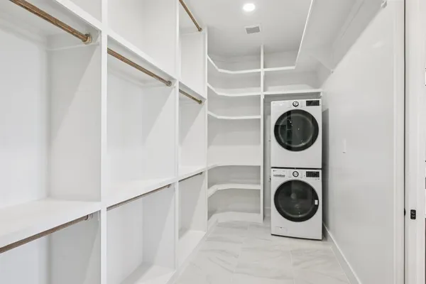 a view of a hallway with washer and dryer