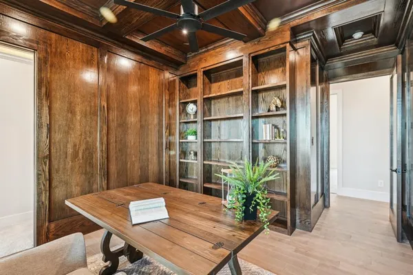 a workspace with furniture and potted plants