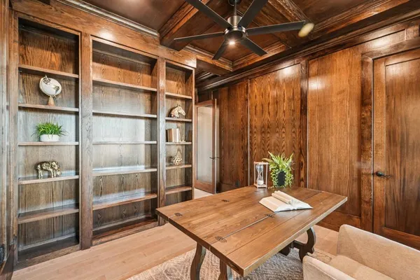 a dining room with a table and chairs
