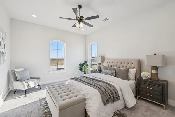 a bedroom with a bed and window