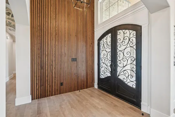 a view of front door with wooden floor