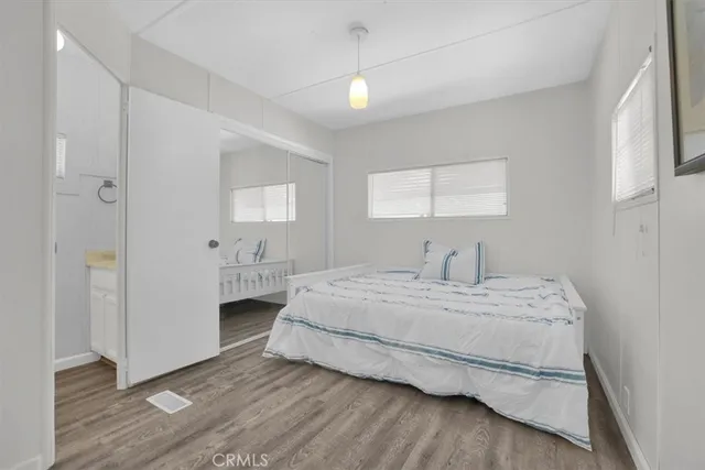 a white toilet sitting next to a window