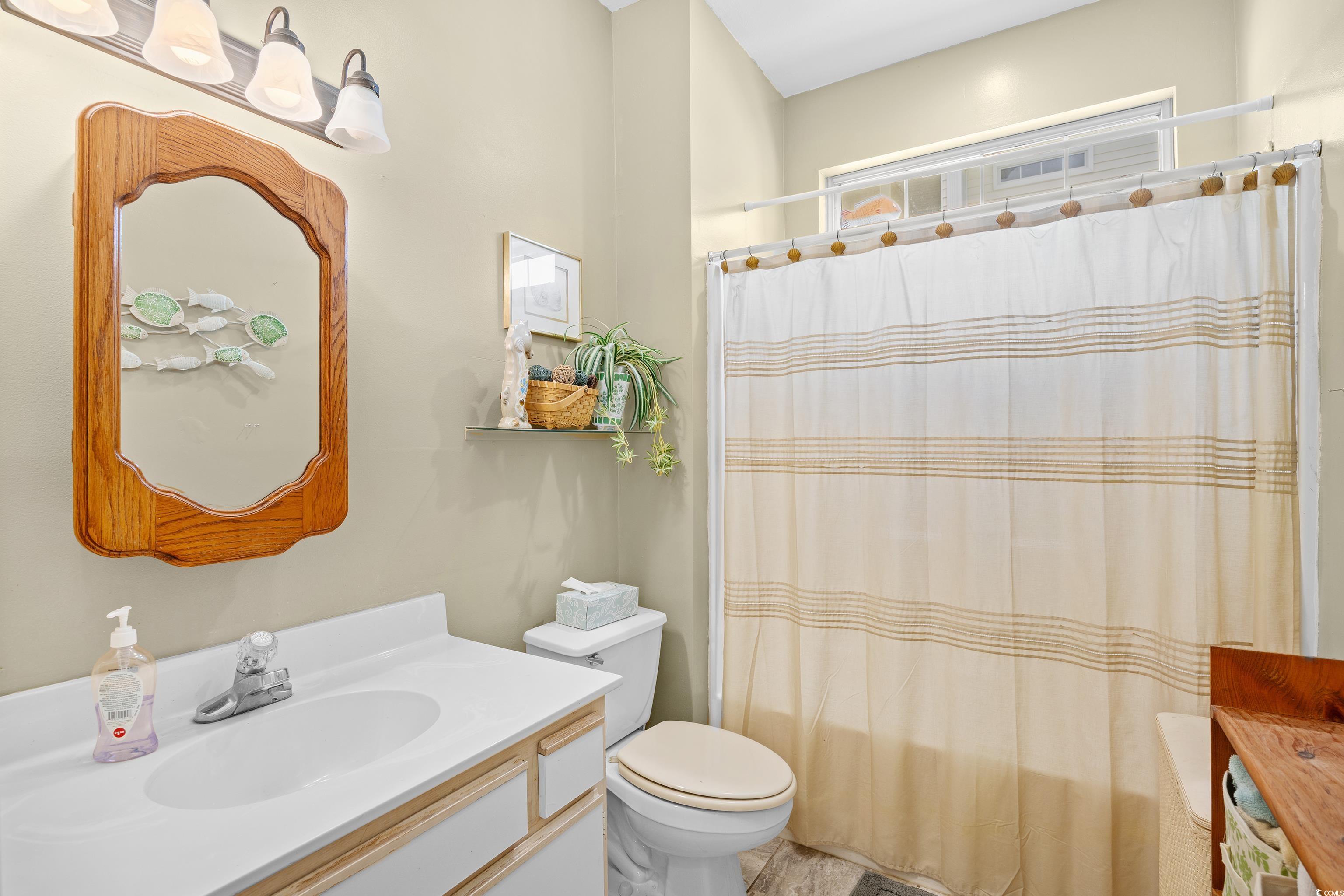 1298 River Oaks Drive, Unit 5J Myrtle Beach, SC 29579 - Photo 15 of 33 Bathroom featuring vanity and shower / bath combo