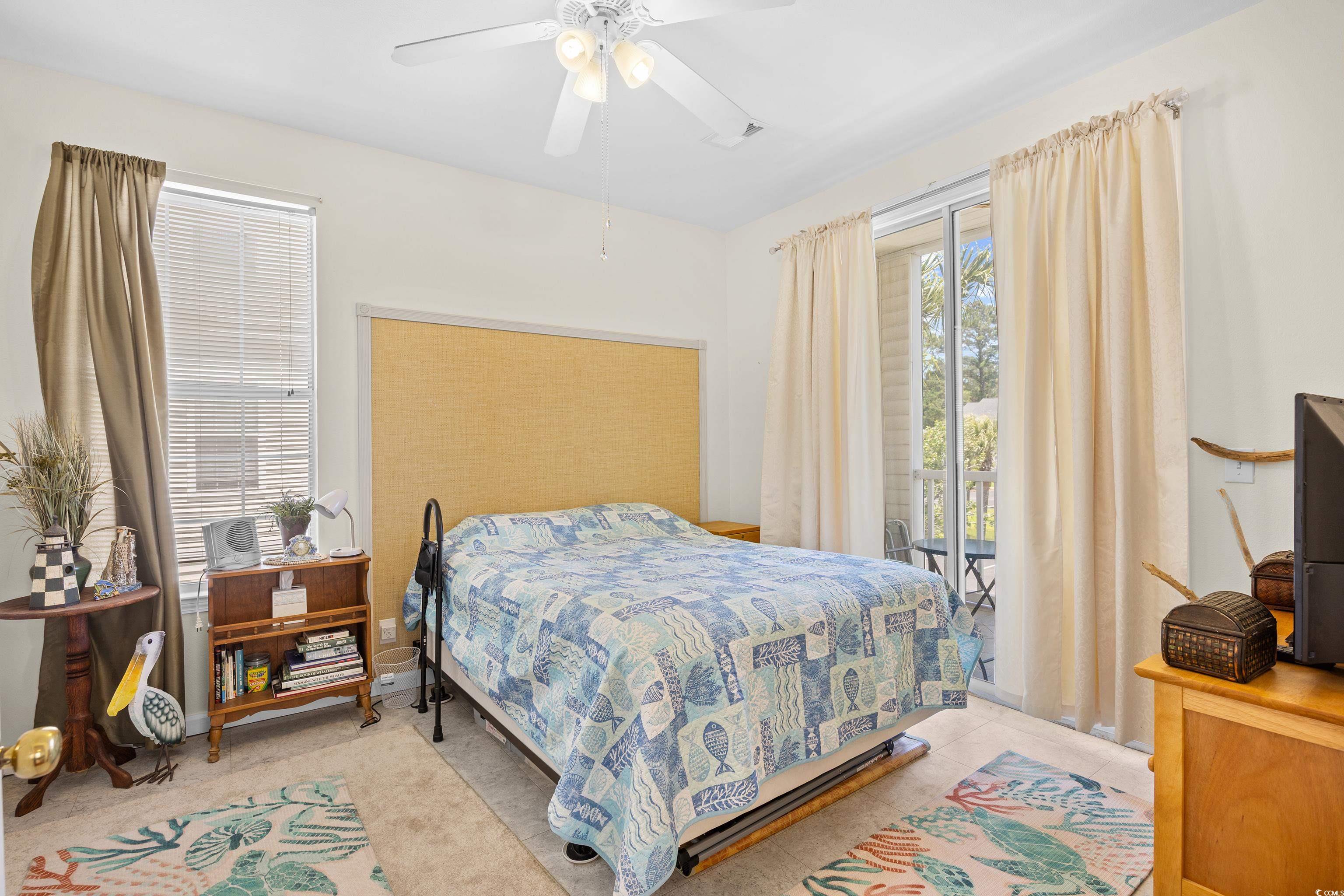 1298 River Oaks Drive, Unit 5J Myrtle Beach, SC 29579 - Photo 17 of 33 Bedroom featuring access to exterior and ceiling fan