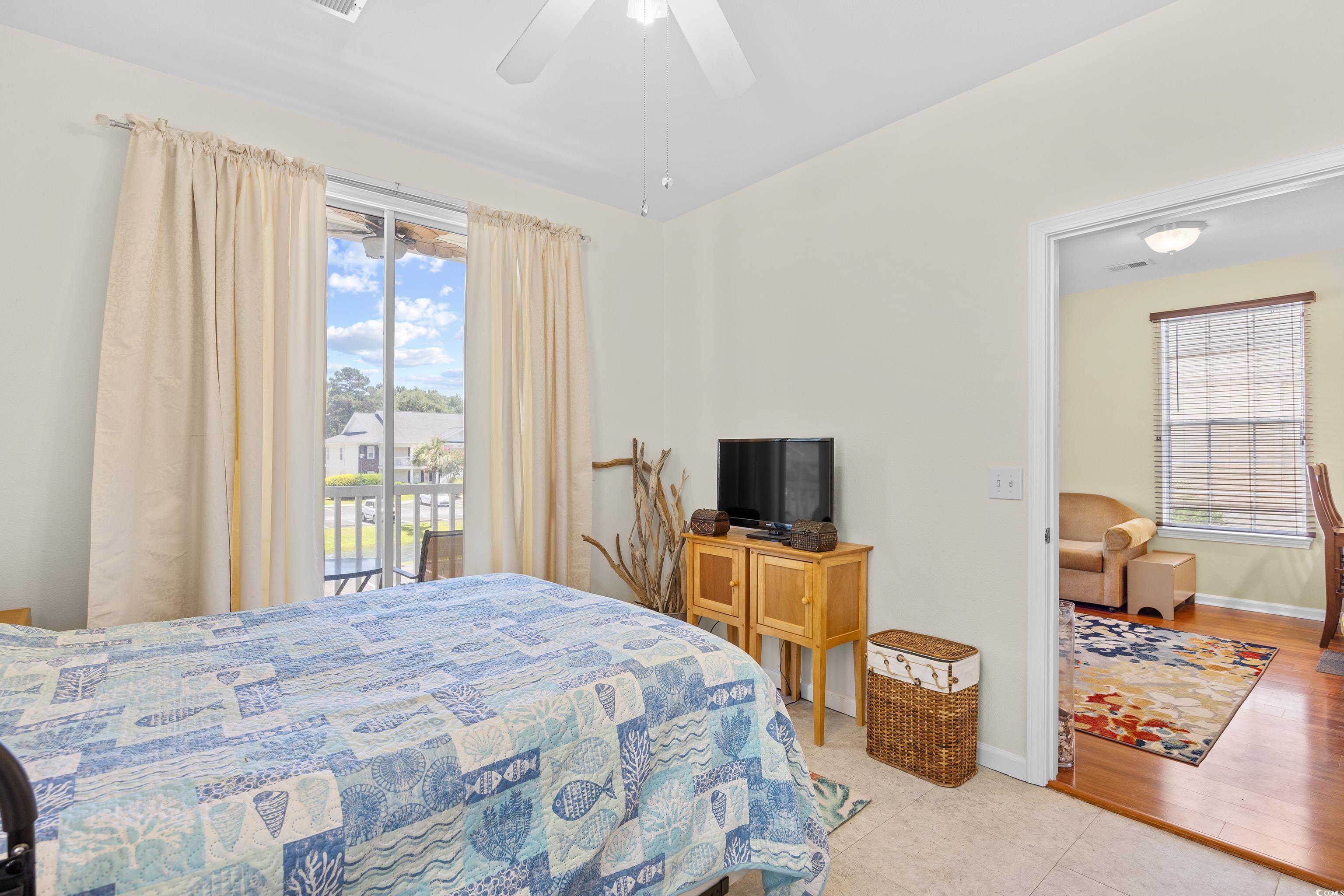 1298 River Oaks Drive, Unit 5J Myrtle Beach, SC 29579 - Photo 18 of 33 Bedroom with ceiling fan and light tile patterned flooring