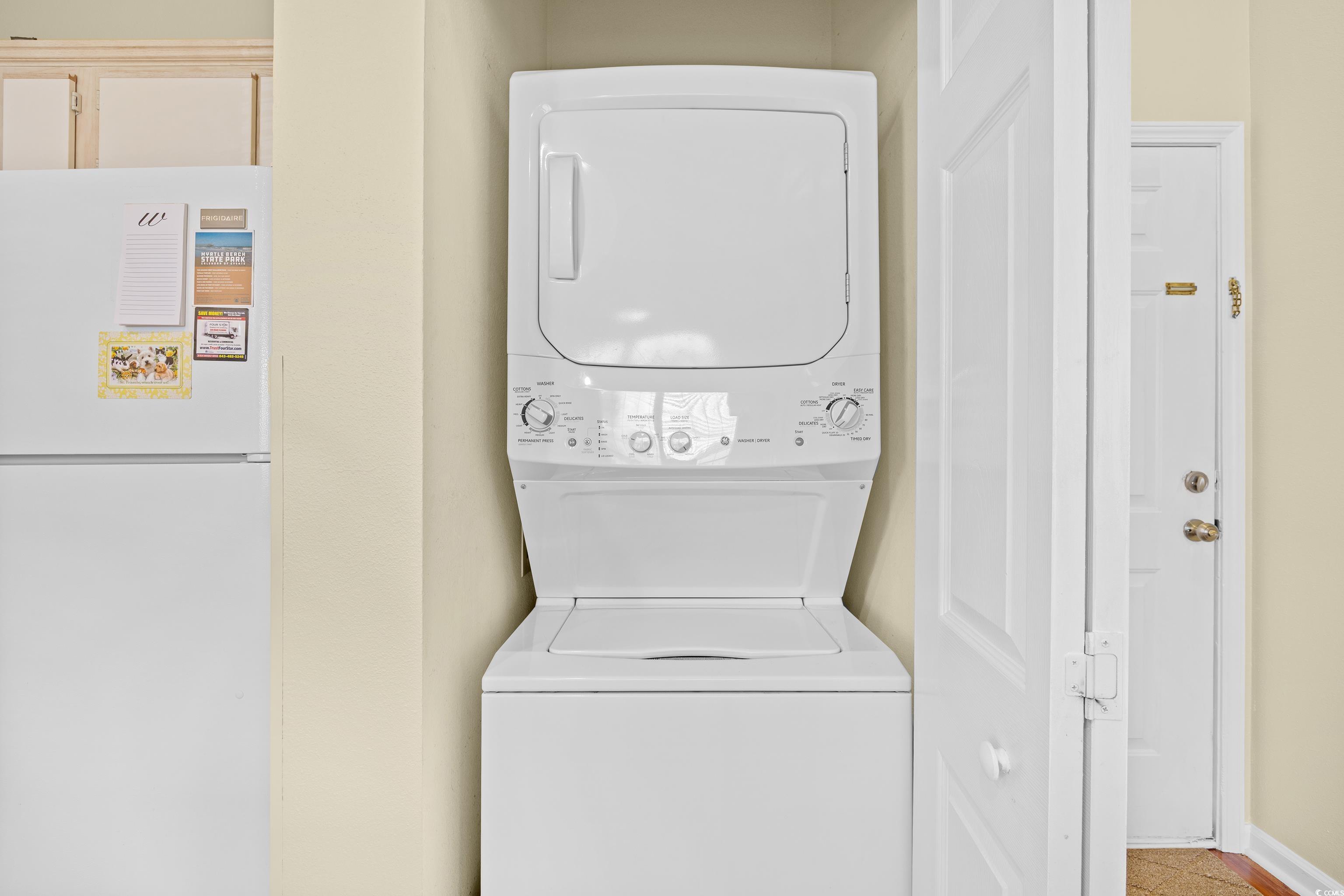 1298 River Oaks Drive, Unit 5J Myrtle Beach, SC 29579 - Photo 21 of 33 Laundry room with stacked washer / dryer