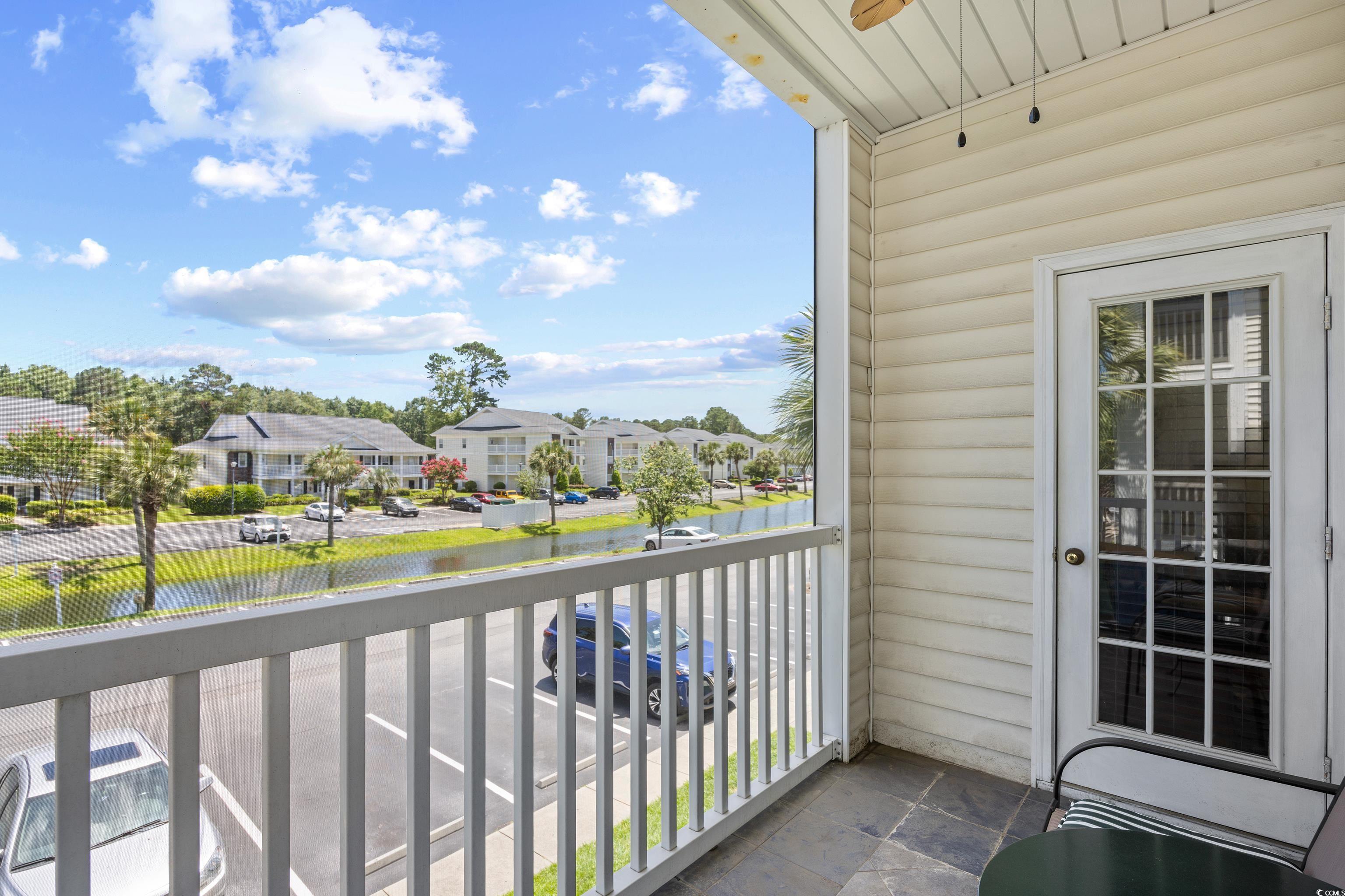 1298 River Oaks Drive, Unit 5J Myrtle Beach, SC 29579 - Photo 23 of 33 Balcony featuring a residential view, a water view, and ceiling fan
