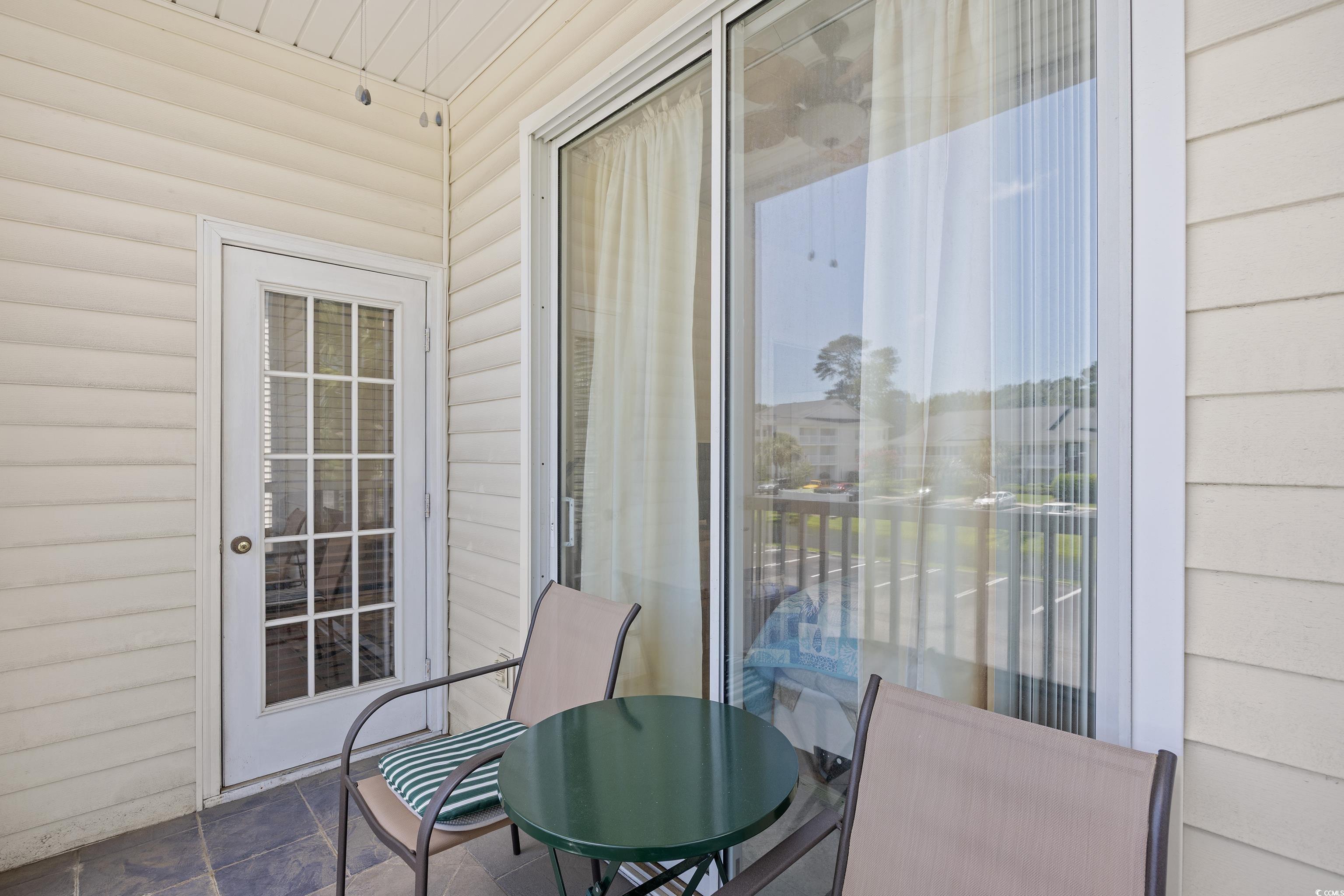 1298 River Oaks Drive, Unit 5J Myrtle Beach, SC 29579 - Photo 24 of 33 Balcony with outdoor dining area