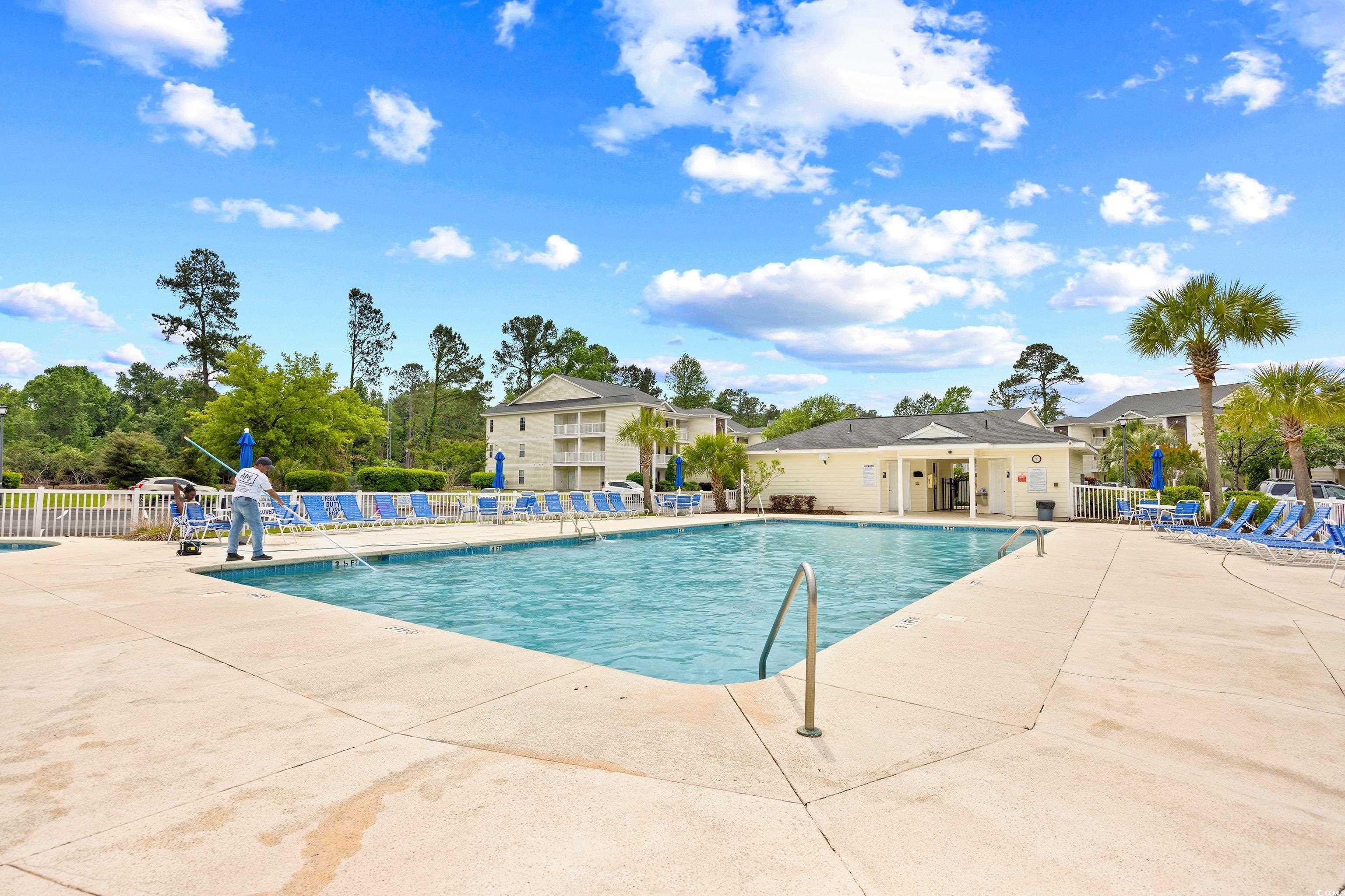 1298 River Oaks Drive, Unit 5J Myrtle Beach, SC 29579 - Photo 32 of 33 Community pool featuring a residential view