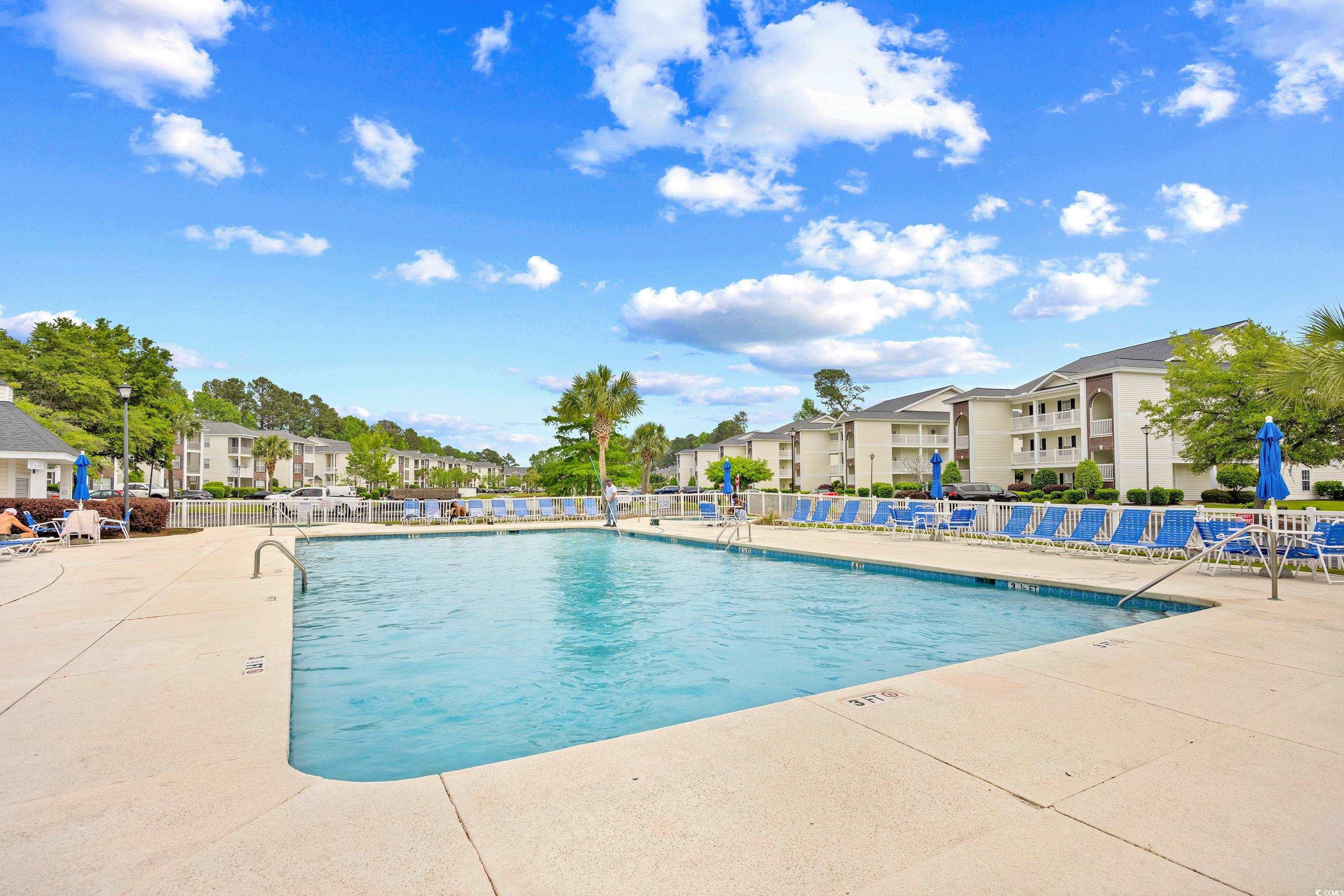 1298 River Oaks Drive, Unit 5J Myrtle Beach, SC 29579 - Photo 33 of 33 Community pool featuring a patio