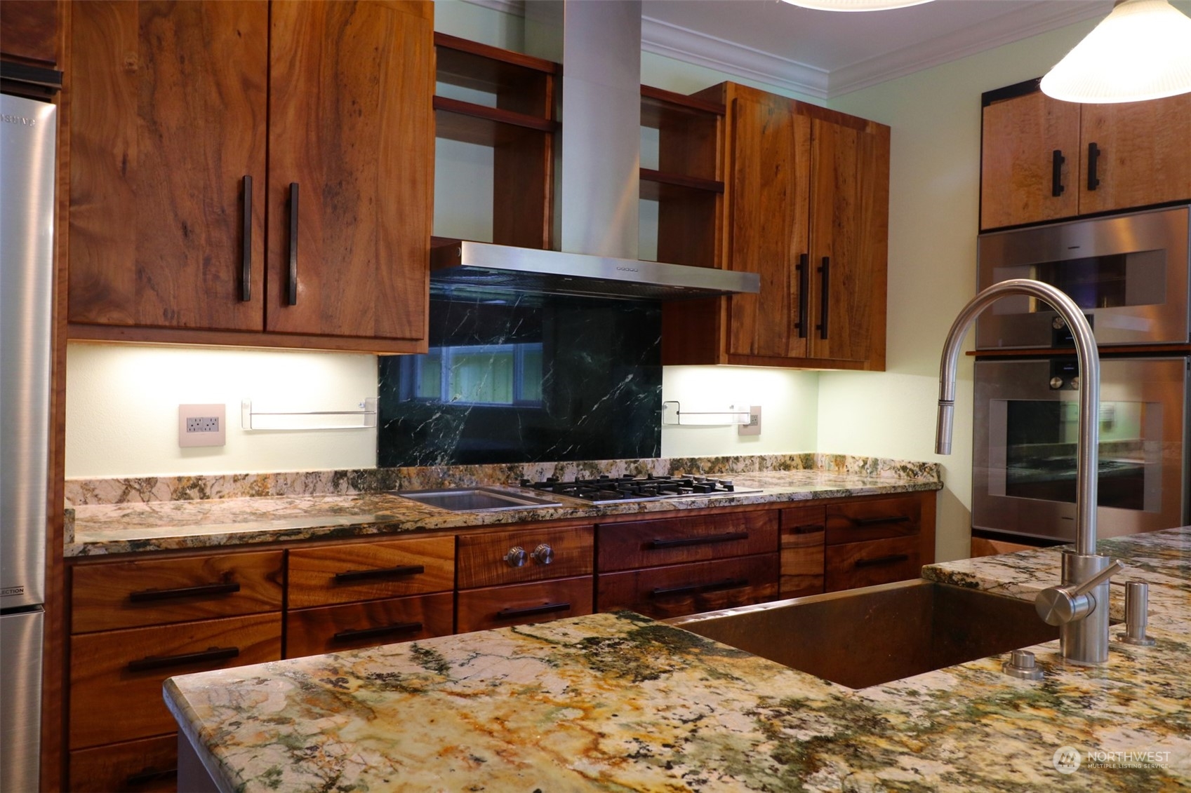 1908 4th Street Bremerton, WA 98337 - Photo 11 of 34 a kitchen with stainless steel appliances granite countertop a stove and a refrigerator