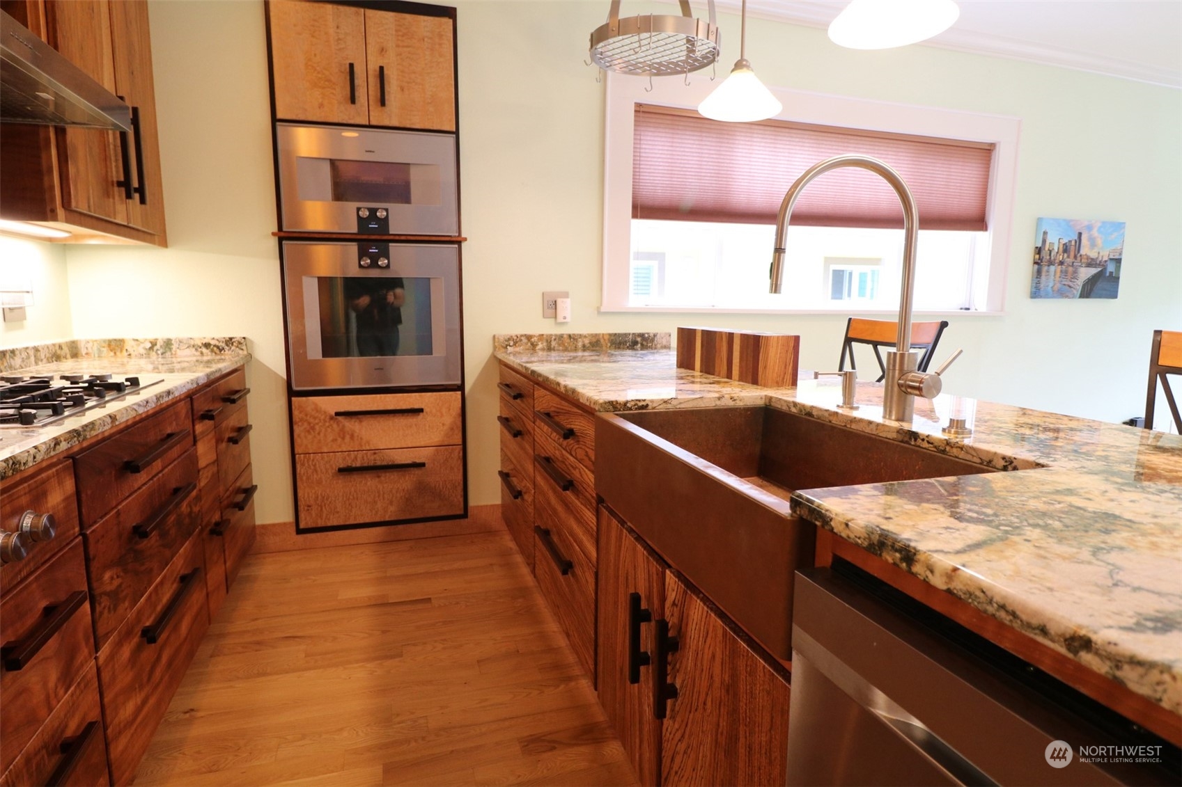 1908 4th Street Bremerton, WA 98337 - Photo 12 of 34 a kitchen with stainless steel appliances granite countertop a stove a sink and a wooden floors