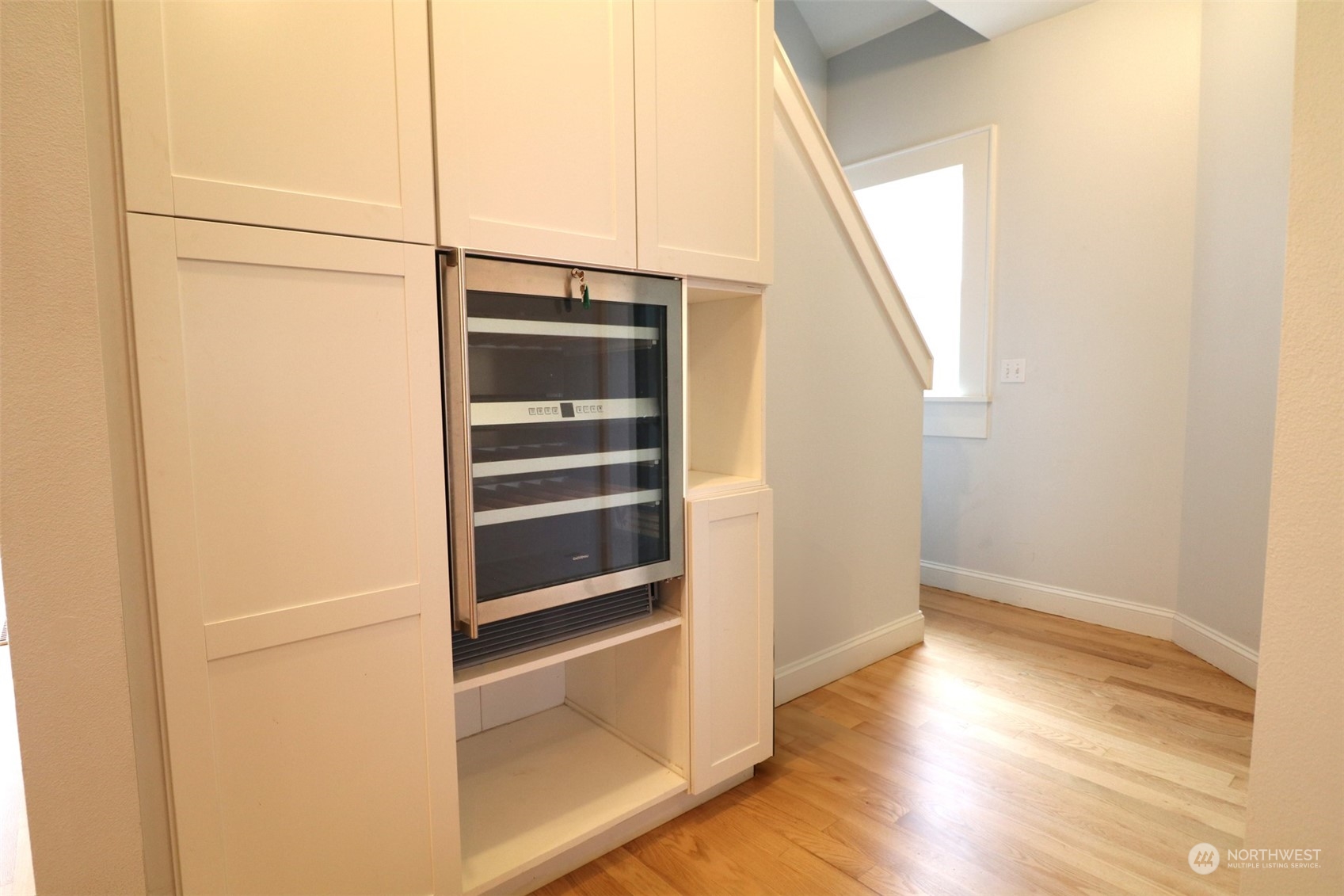 1908 4th Street Bremerton, WA 98337 - Photo 15 of 34 a view of an empty room with wooden floor and a window