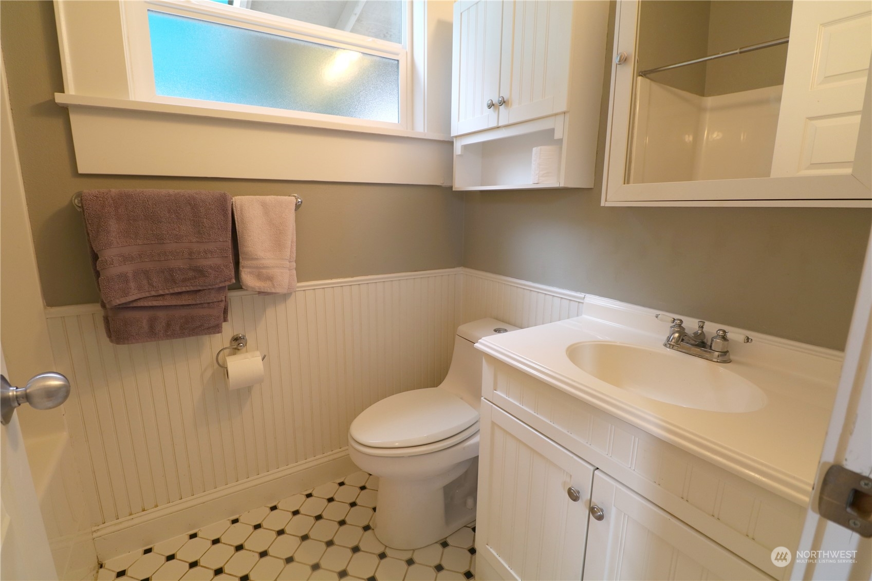 1908 4th Street Bremerton, WA 98337 - Photo 17 of 34 a white toilet sitting next to a bathroom sink